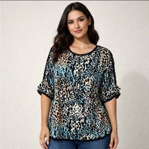 St. John Women’s blue white black animal print blouse, top. Size L